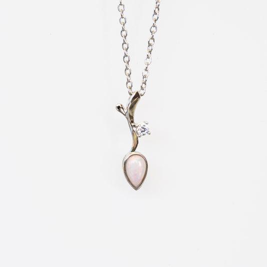 Silver necklace with a teardrop-shaped opal pendant on a white background