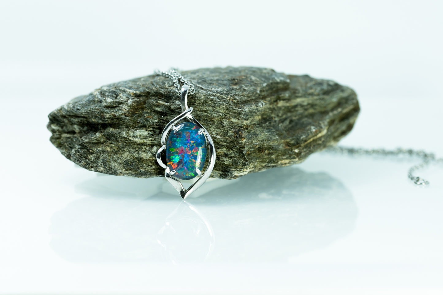 Necklace with an opal pendant on a rock